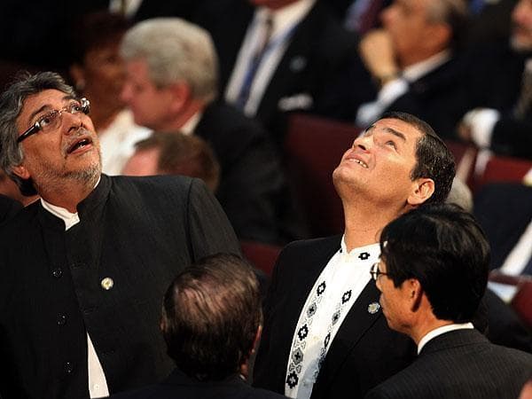 Paraguay's President Fernando Lugo, left, and Ecuador's President Rafael Correa react during an aftershock as Chile's President Sebastian Pinera was sworn into office in Valparaiso, Chile on Thursday. (AP)