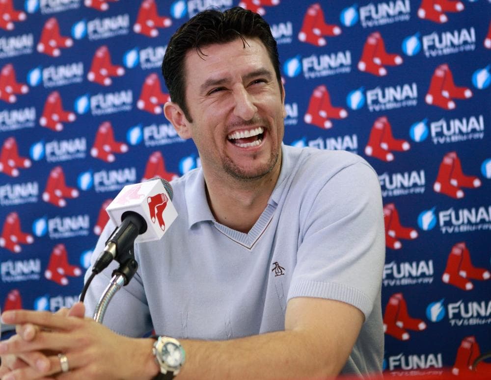 Former Boston Red Sox shortstop Nomar Garciaparra takes questions during a news conference in Fort Myers, Fla. on Wednesday. The 1997 American League MVP signed a one-day contract with his former team, then announced he's ending his 14-year career. (AP)