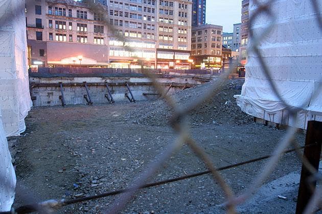 At Downtown Crossing, there's now a gaping hole where Filene's Basement once stood. For nearby store owners, the hole is an eyesore and a drain on business. (Andrew Phelps/WBUR)