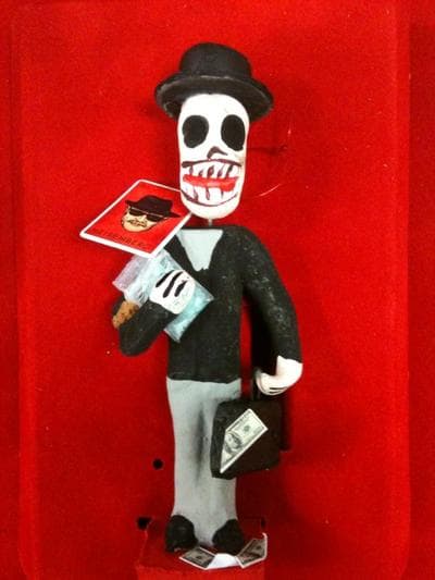 A macabre statue of Bryan Cranston's character, Walt White, represents his moral decay.