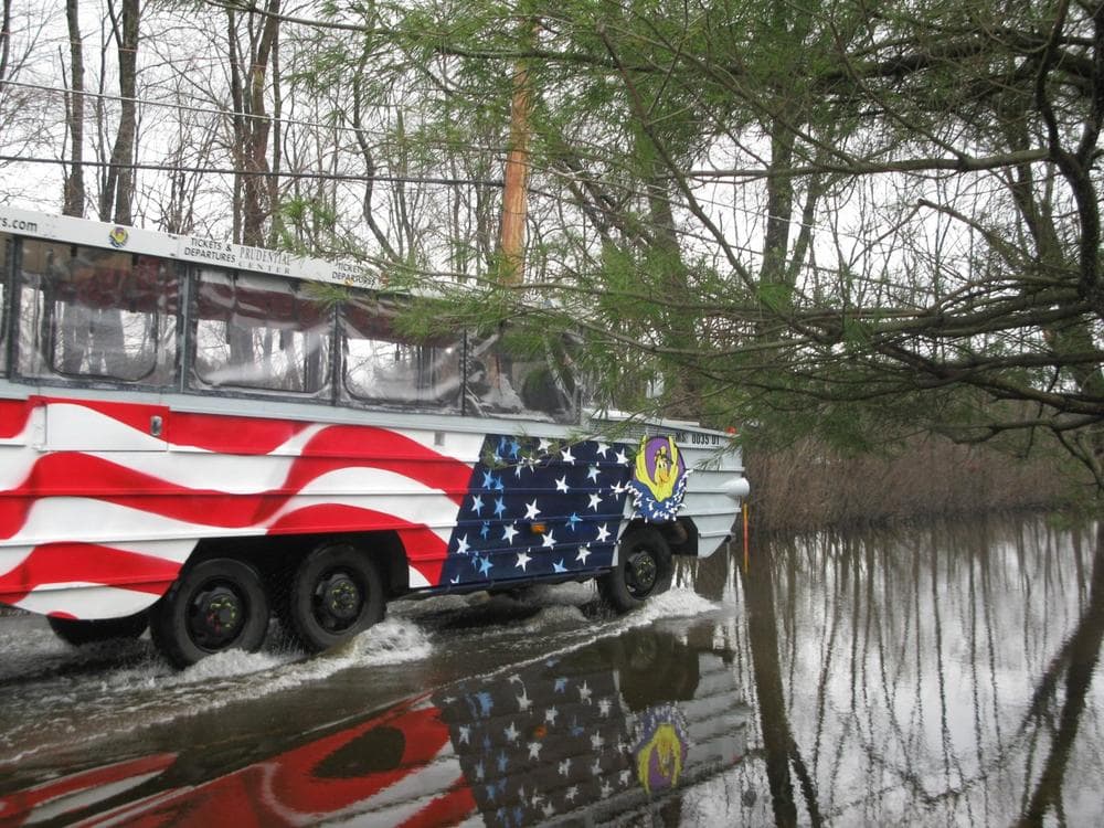 A duck boat ferries passengers to and from their homes in Wayland. (Fred Thys/WBUR)