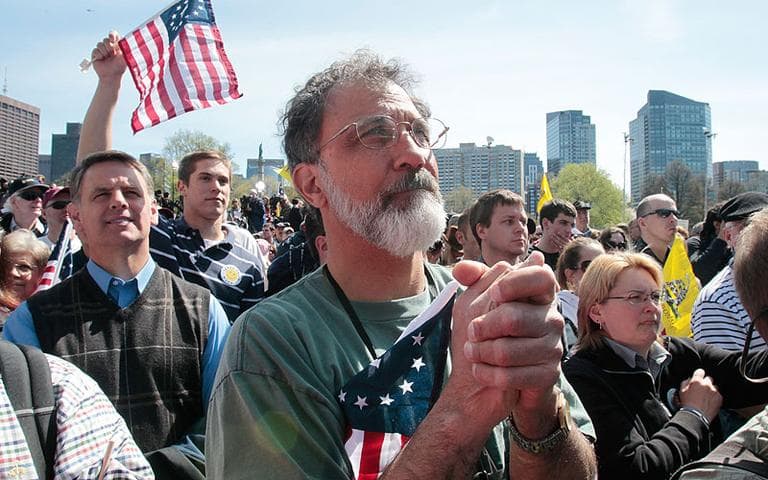 Val Touba, of Bedford, N.H., clenches his hands as he listens to Sarah Palin address the crowd at the Tea Party rally on Boston Common on Wednesday. (AP)