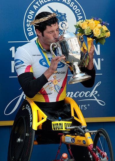 Men's wheelchair winner Ernst Van Dyk, of South Africa, kisses his trophy after the 114th running of the Boston Marathon on Monday. (AP) (Click to enlarge)