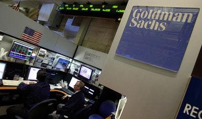Traders work in the Goldman Sachs booth on the floor of the New York Stock Exchange on Monday. (AP)