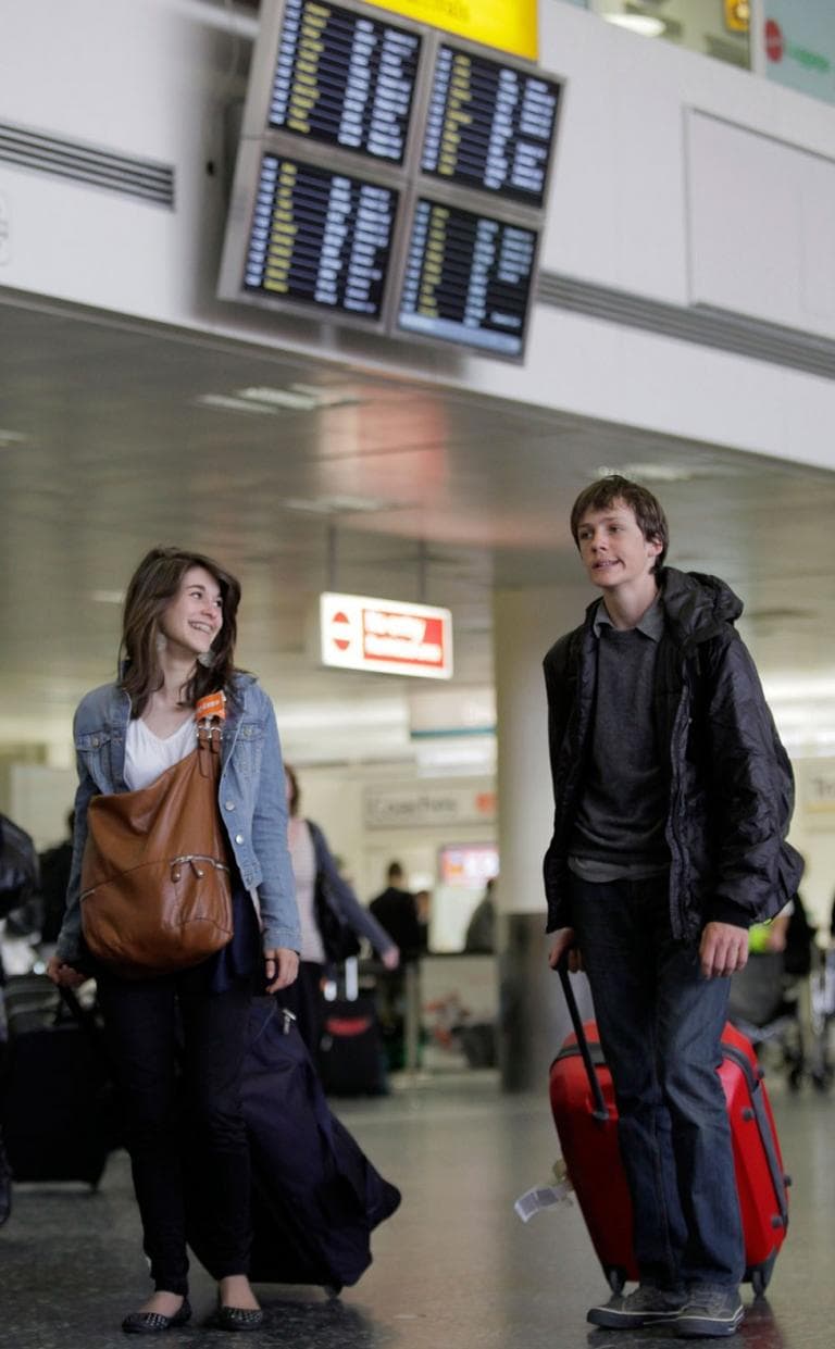 People exit the Gatwick airport, near London, England, on Wednesday. Britain's Heathrow Airport — Europe's busiest hub — has seen the first flight land in London since airspace across the continent was closed by the Icelandic volcano. (AP)