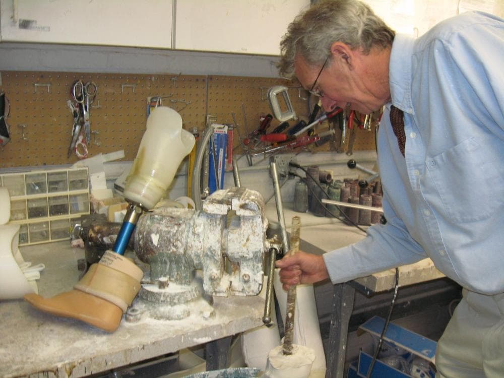 Frank Shirley works in the "brace shop" at Milton Hospital, which makes prosthetic limbs and orthotic braces for people with amputations and other injuries. (Sacha Pfeiffer/WBUR)