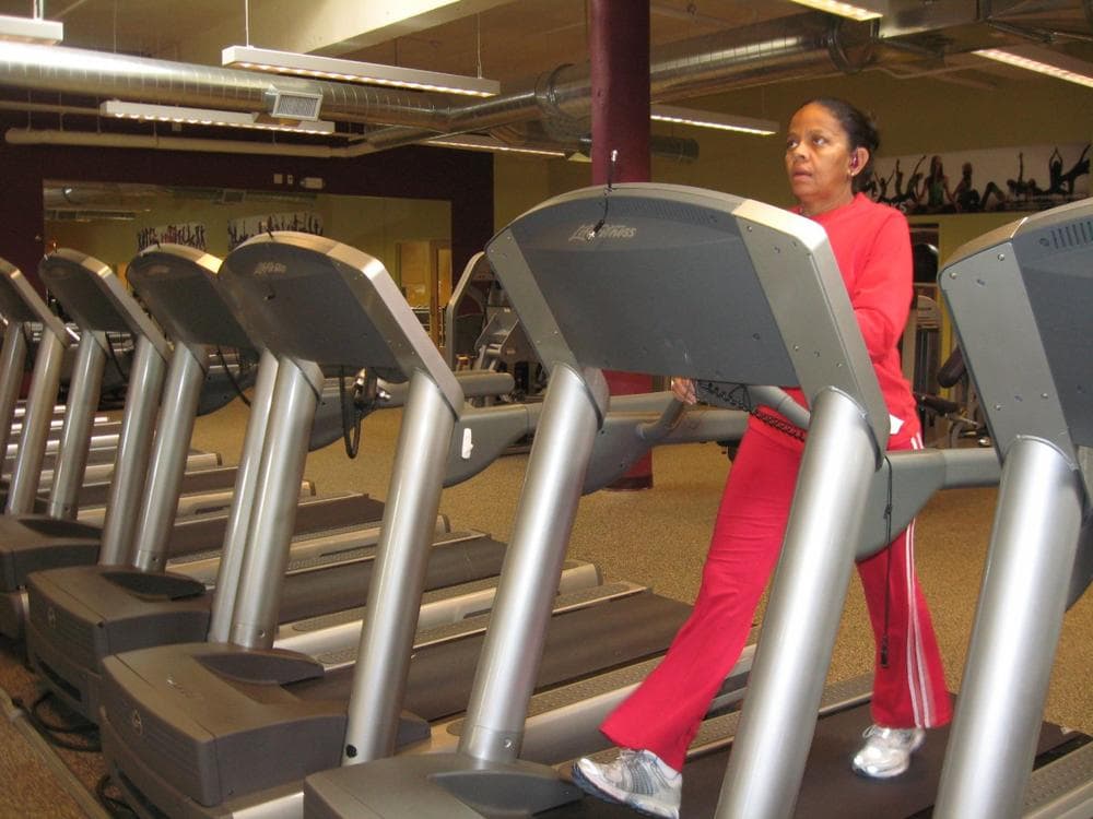 A gym member works out at Healthworks at Codman, a nonprofit fitness center in Dorchester. (Sacha Pfeiffer/WBUR)