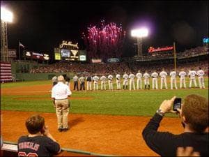 The players line up during the national anthem. (Sam Fleming/WBUR)