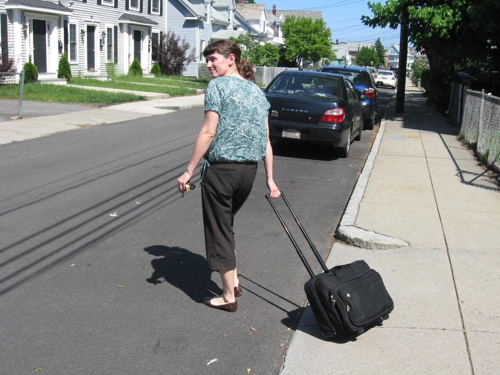 Laura Starr, a social worker with the Visiting Nurse Association of Boston, makes a house call to a young mother suffering from depression. (Sacha Pfeiffer/WBUR)