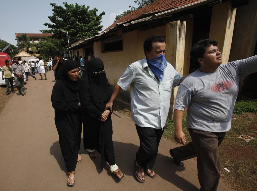 Relatives arrive at a mortuary to identify the victims of the Air India Express plane crash in Mangalore, in the southern Indian state of Karnataka, Sunday. (AP Photo/Aijaz Rahi)