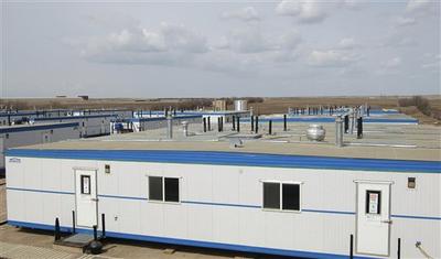 Portable homes that house an influx of oil workers in a so-called "man camp," are shown on the outskirts of Stanley, N.D. (AP)