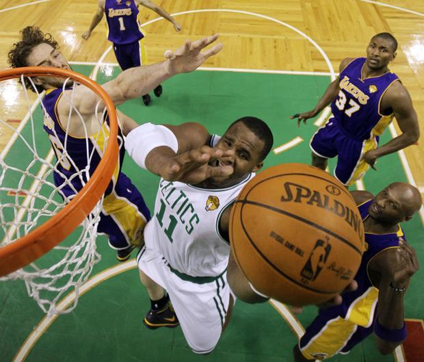 Boston forward Glen Davis drives between Los Angeles' Pau Gasol,  Ron Artest and Lamar Odom during Game 3 of the NBA finals on Tuesday in Boston. The Lakers won 91-84. (AP)