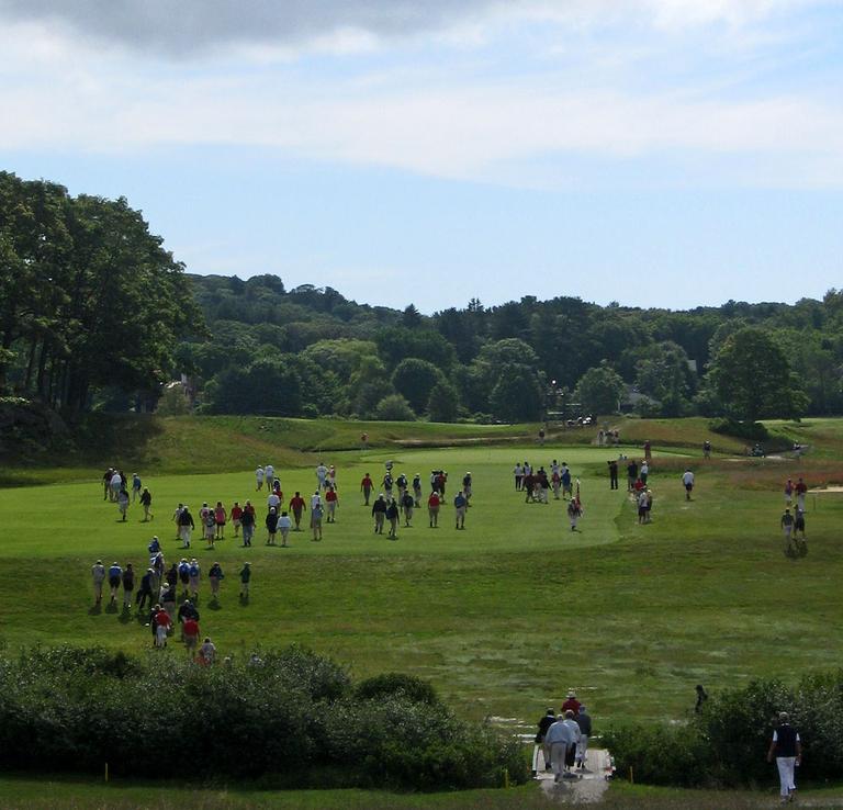Fans make their way down the first fairway at Essex County Club. The club last hosted the Curtis Cup in 1938. (Doug Tribou/WBUR)