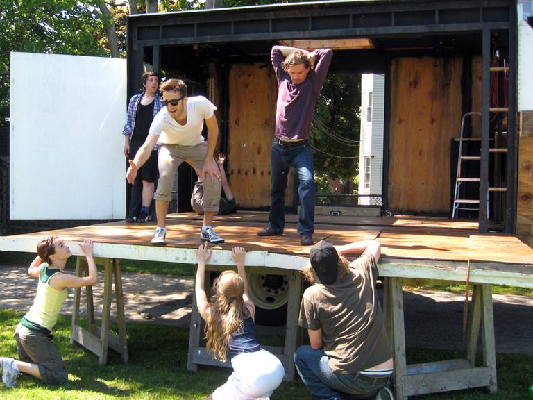 With "The Theatre Truck" parked and opened, its actors go through a recent rehearsal. (Andrea Shea/WBUR)