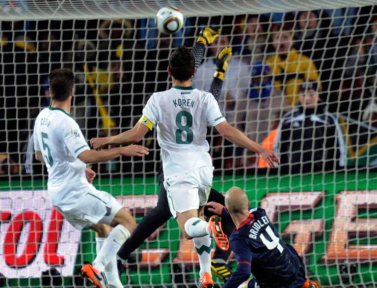 United States' Michael Bradley, bottom right, scores the tying goal against Slovenia in Johannesburg, South Africa, on Friday. (AP)