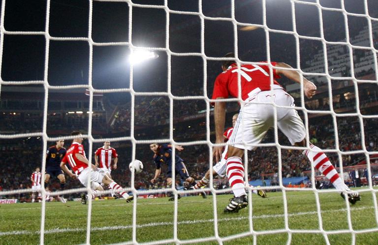 David Villa, center, scores the winning goal that beat Paraguay and sent Spain into the World Cup semifinals. (AP)