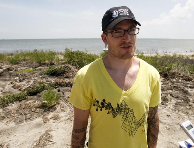 Boston Bruins' defenseman Andrew Ference talks with reporters during a tour of oil damaged areas near Barataria Bay, La., on Tuesday. (AP)