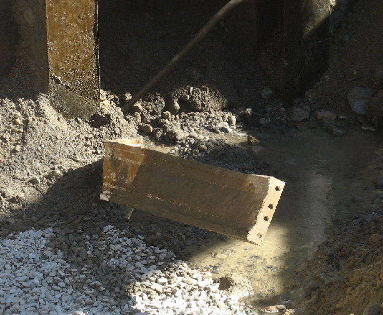The 1-ton coupling was found as MWRA workers excavated in Weston Thursday. (Steve Brown/WBUR)