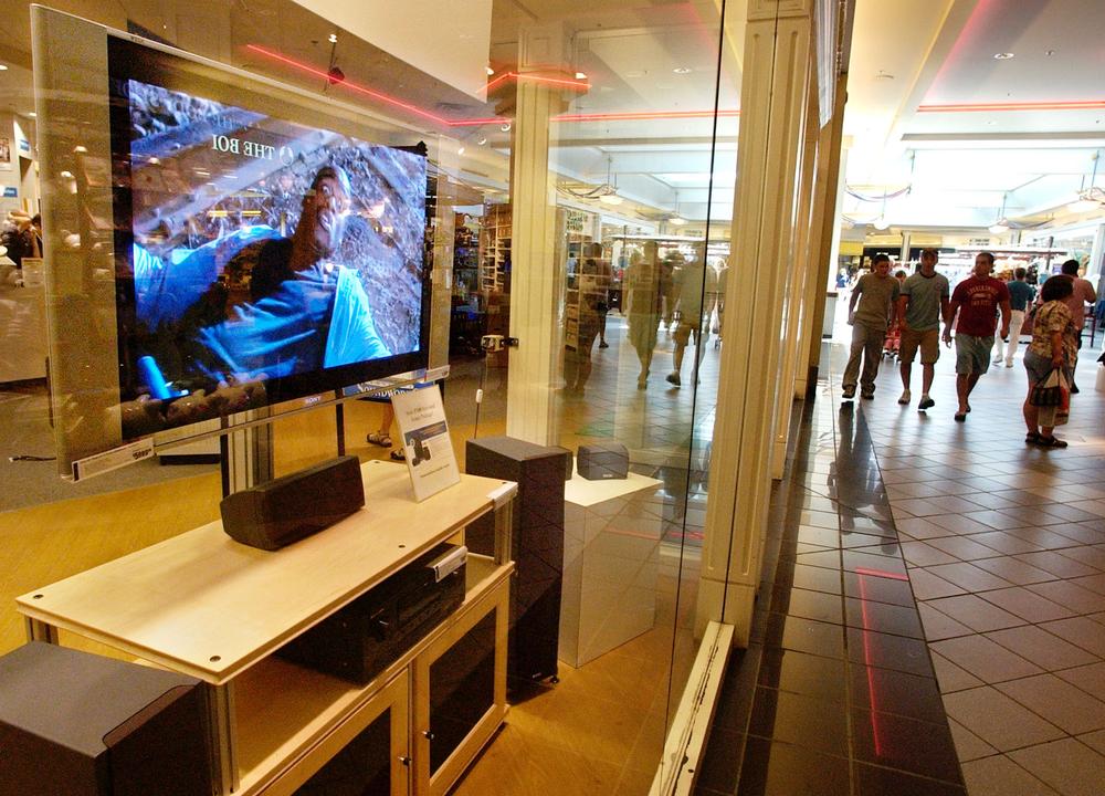 Shoppers walk through the Northshore Mall in Peabody during the first-ever Massachusetts sales tax holiday on Aug. 14, 2004. (AP)