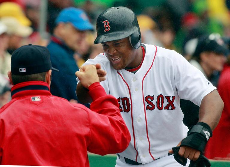 Boston Red Sox's Adrian Beltre, right, is congratulated after scoring on a single by teammate Daniel Nava against the Seattle Mariners during the sixth inning on Wednesday. (AP)