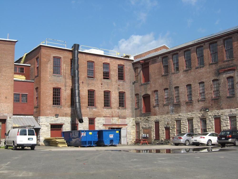 It was empty a couple of weeks ago, but the space around MASS MoCA will be transformed into a multi-stage performance venue at this weekend's Solid Sound Festival, curated by Wilco. (Andrea Shea/WBUR)