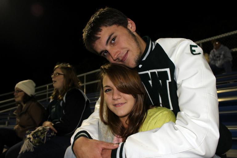 Nick Foster, 19, was the starting tight end on last year's championship team. He's still in Ware, doing some carpentry and working at a local shake shack. His girlfriend Crystal, front, wants to go to college in Worcester next year. (Lisa Tobin/WBUR)