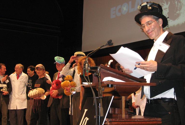 Marc Abrahams, founder of the Ig Nobel Prize, with actual Nobel Laureates at the 20th annual Ig Nobel Prize ceremony. (Griff McNerney for WBUR)