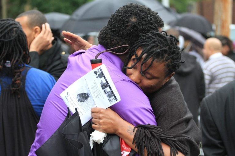 Mourners at Simba Martin's funeral. (Andrew Phelps/WBUR)