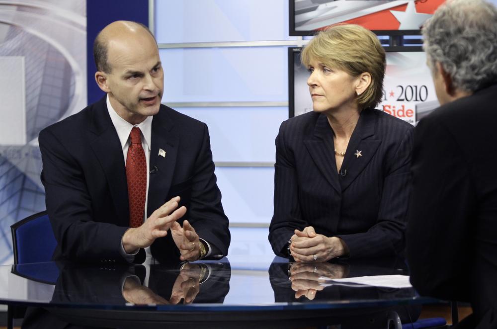 Republican attorney general candidate James McKenna, left, and Democratic Attorney General Martha Coakley, center, participate in a debate in Newton on Sept. 30. (AP)