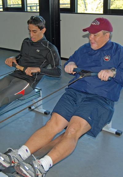 When language differences get in the way, sometimes it’s easier to row alongside and show the right way to row. (Karen Given/WBUR)