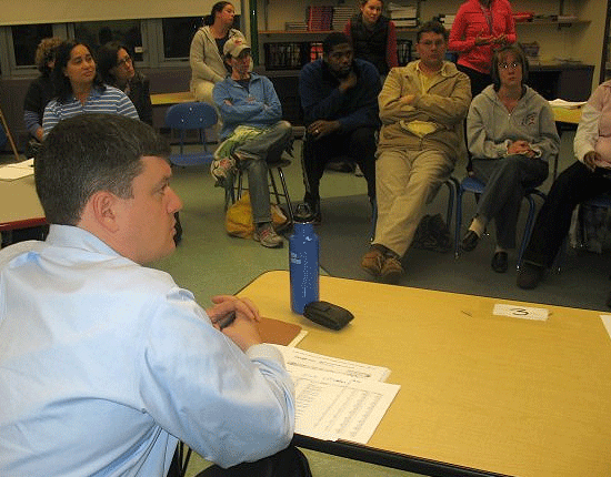 Boston City Councilor John Connolly hears from angry parents at the Lee Academy Pilot School. (Monica Brady-Myerov/WBUR)