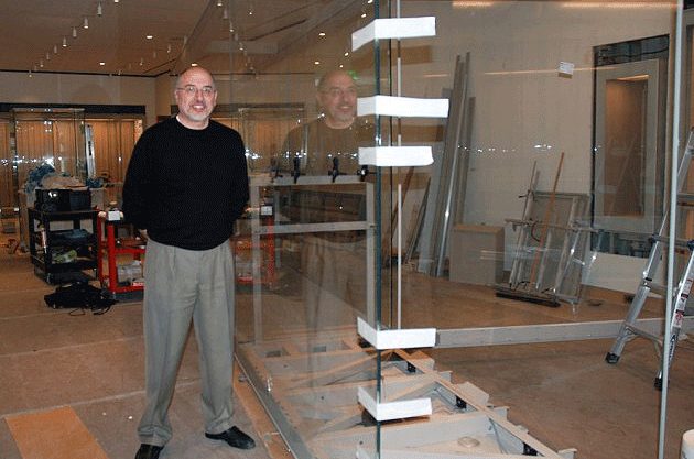 Ted Paschkis, the Boston-based director of operations for Goppion US, with a newly installed case at the MFA. (Andrea Shea/WBUR)