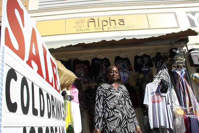 Maureen Idehen owns a boutique in downtown Plymouth. As the number of tourists visiting Plymouth dwindled, Idehen admits this past year has been tough &mdash; her sales have fallen by one-third. (Kirk Carapezza for WBUR)