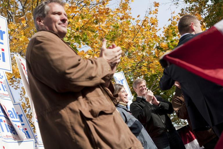 Sen. Scott Brown, left, stumps for gubernatorial candidate Charlie Baker, center, and other Republican candidates at an rally in Foxborough, Oct. 30. (Dominick Reuter for WBUR) 