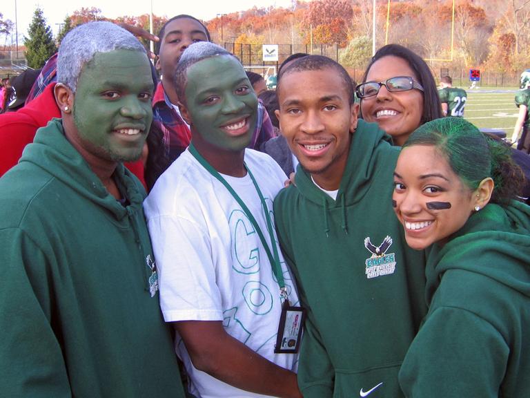 Students at Post University embrace their school's first-ever football team. (Doug Tribou/WBUR)