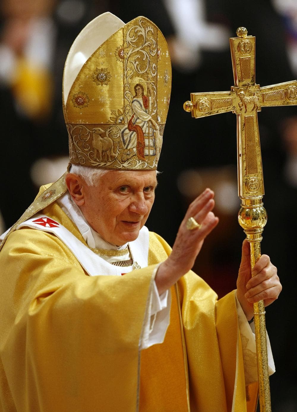 Pope Benedict XVI blesses the faithful as he arrives in St. Peter's Basilica to celebrate a mass at the Vatican, Sunday.  (AP Photo/Pier Paolo Cito)