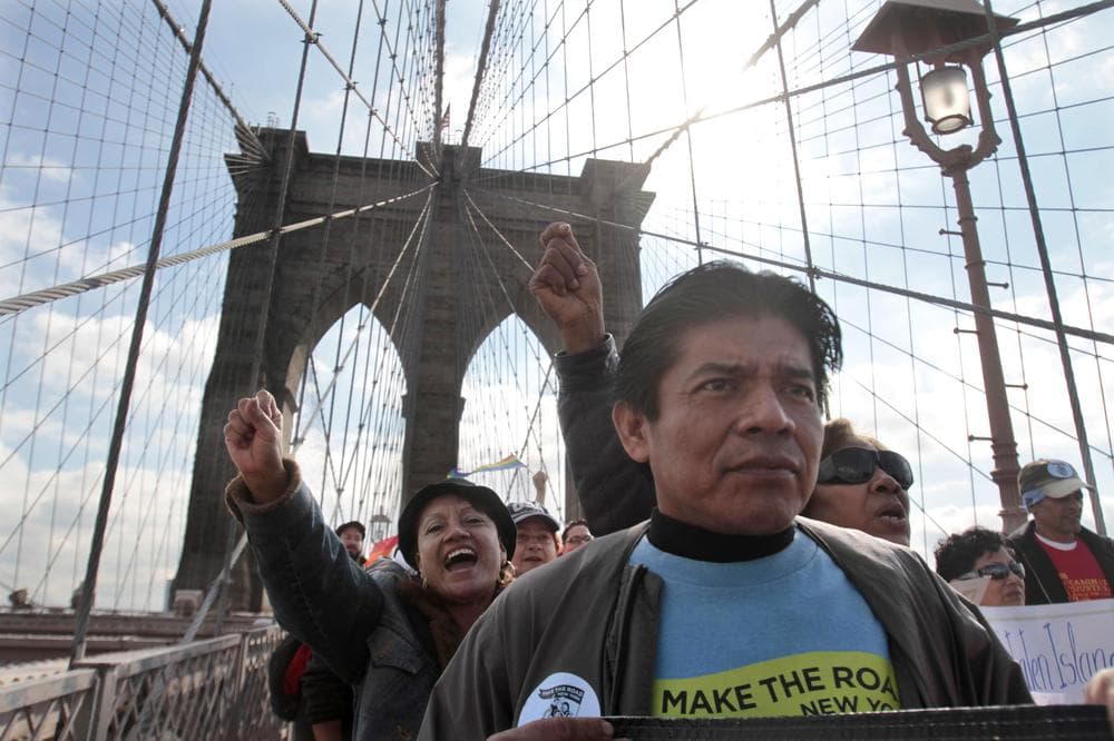A coalition of Latino workers and leaders march over New York's Brooklyn Bridge against a Department of Corrections policy to "funnel" illegal immigrants into the Immigration and Customs Enforcement (ICE) detention and deportation program. (AP)