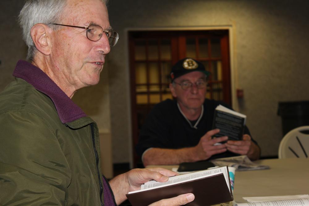 Members of a book club for homeless people meet at the Swedenborgian Church on the Hill in Boston on a recent Tuesday morning. (Lisa Tobin/WBUR) 