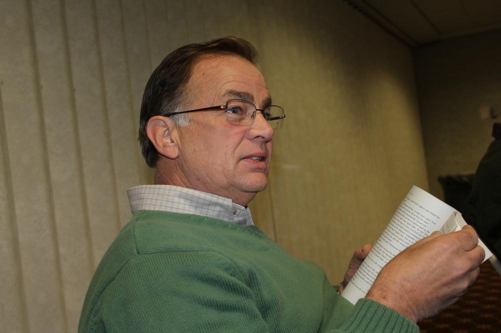 Ron Tibbets, a longtime homeless outreach worker in Boston, leads the meeting. (Lisa Tobin/WBUR)