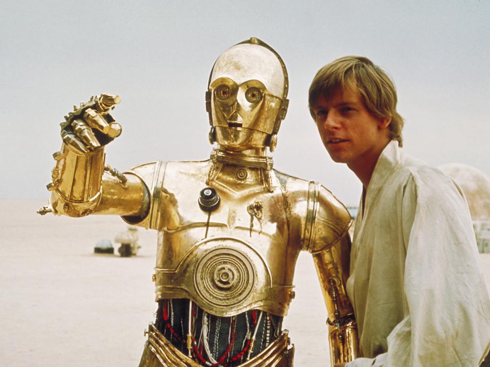 C3PO, the droll droid of Star Wars fame, is shown with the character Luke Skywalker, played by Mark Hamill. (AP/Copyright 2004 Lucasfilm Ltd. & TM. All rights reserved.)