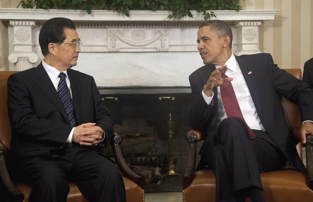 President Barack Obama meets with China's President Hu Jintao in the Oval Office of the White House ahead of a state dinner Wednesday night. (AP)