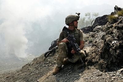 Sergeant Brendan O'Byrne of Second Platoon, Battle Company awaits for a helicopter supply drop at Outpost Restrepo, in the Korengal Valley, Kunar Priovince, Afghanistan. (© Outpost Films/ 2010 Tim Hetherington, from the award winning documentary, "Restrepo.")