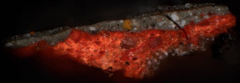 Close-up of a cross section of the painting highlighting the red ground layer that restorers found. (Courtesy of the Isabella Stewart Gardner Museum)