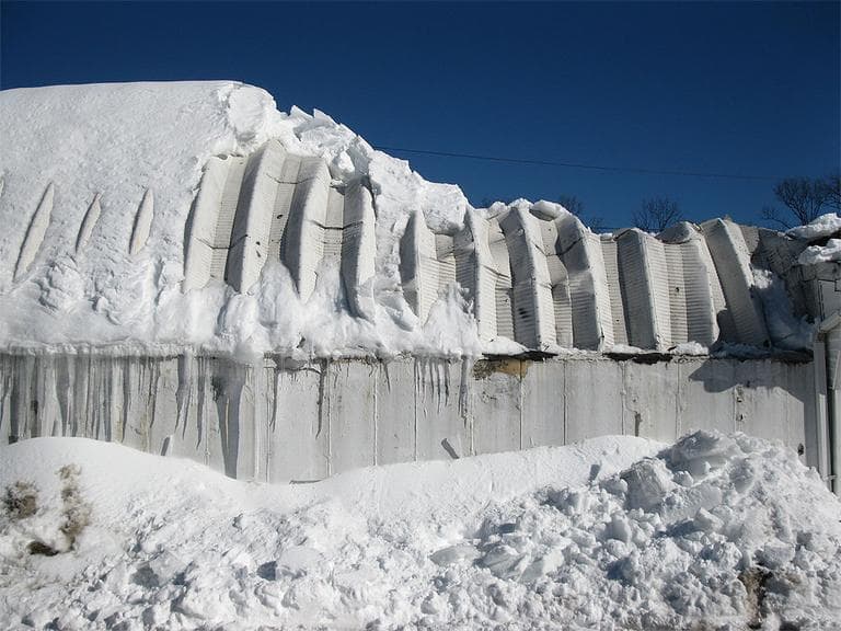 The roof of the Quonset hut that housed Interstate Battery in Auburn Thursday (Fred Thys/WBUR)
