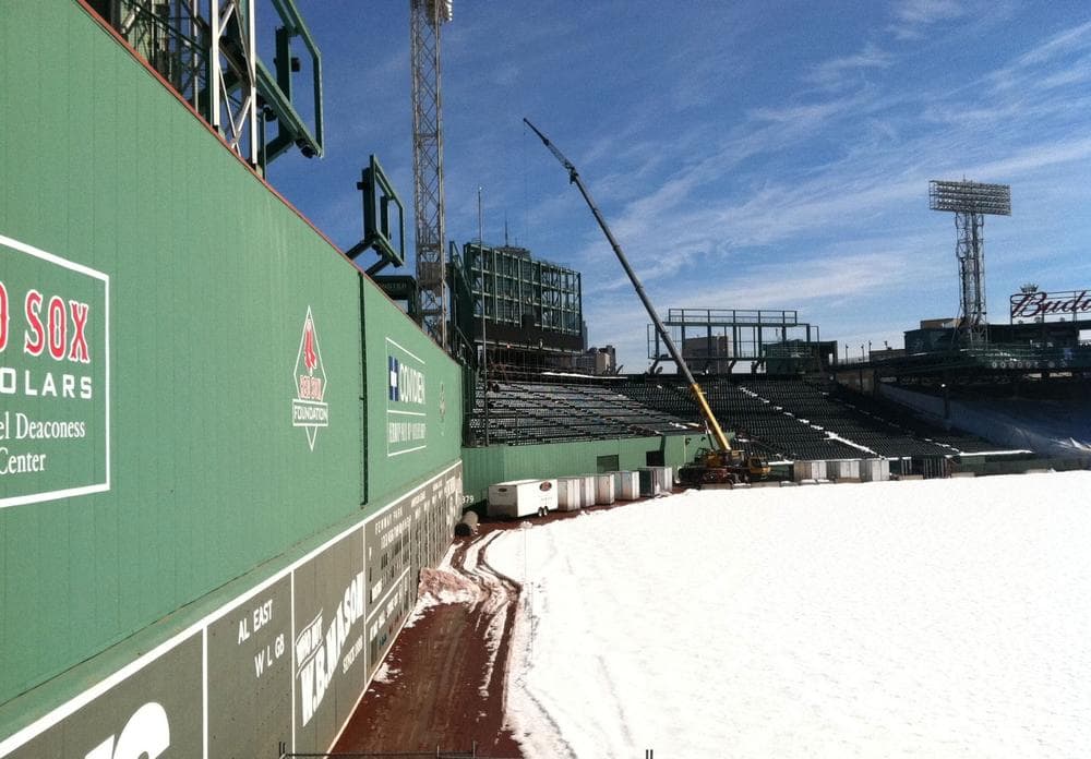 A new LED scoreboard is installed in Fenway Park's center field Friday. (Steve Brown/WBUR)