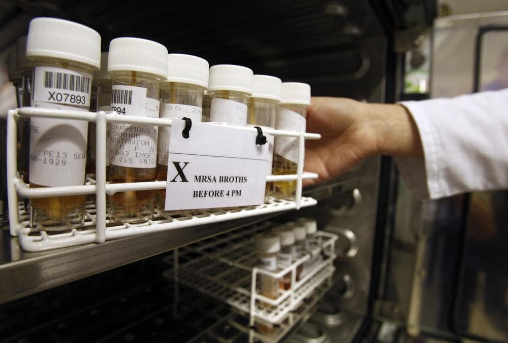 Methicillin-resistant Staphylococcus aureus (MRSA) broths being removed from the incubator in the laboratory at the Queen Elizabeth Hospital in King's Lynn, England. (AP)
