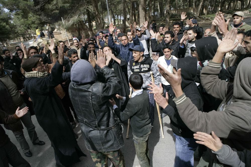 In this photo released by China's Xinhua News Agency, anti-government protesters celebrate in the east Libyan city of Albayda. (AP/Xinhua)