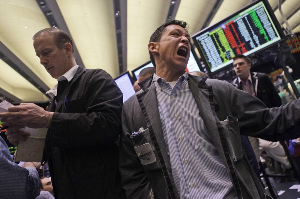 Traders work the crude oil options pit at the New York Mercantile Exchange in New York. (AP)