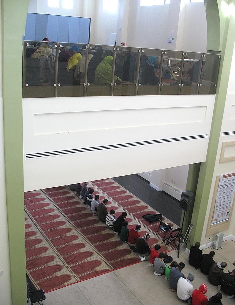 Muslims during the call to prayer (Martha Bebinger/WBUR)