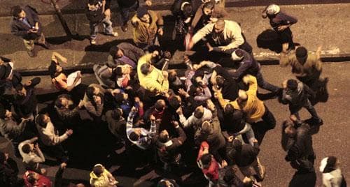 Egyptian President Hosni Mubarak's supporters scuffle with anti-government protesters near the Tahrir (Liberation) Square, Feb. 2, 2011. (AP)